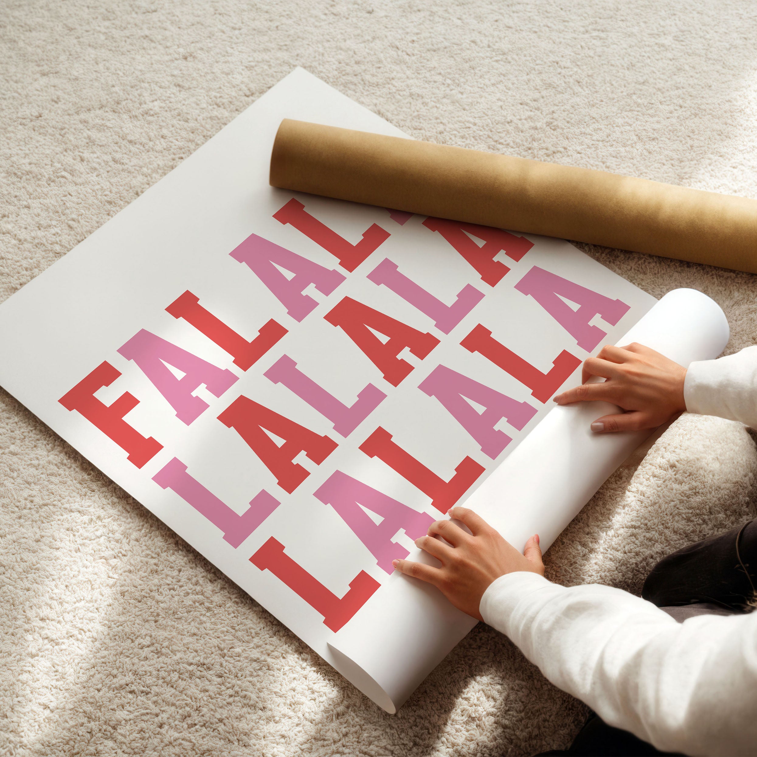 Vibrant holiday wall art in red and pink tones with the phrase ‘Fa La La La La’. A cheerful Christmas design.