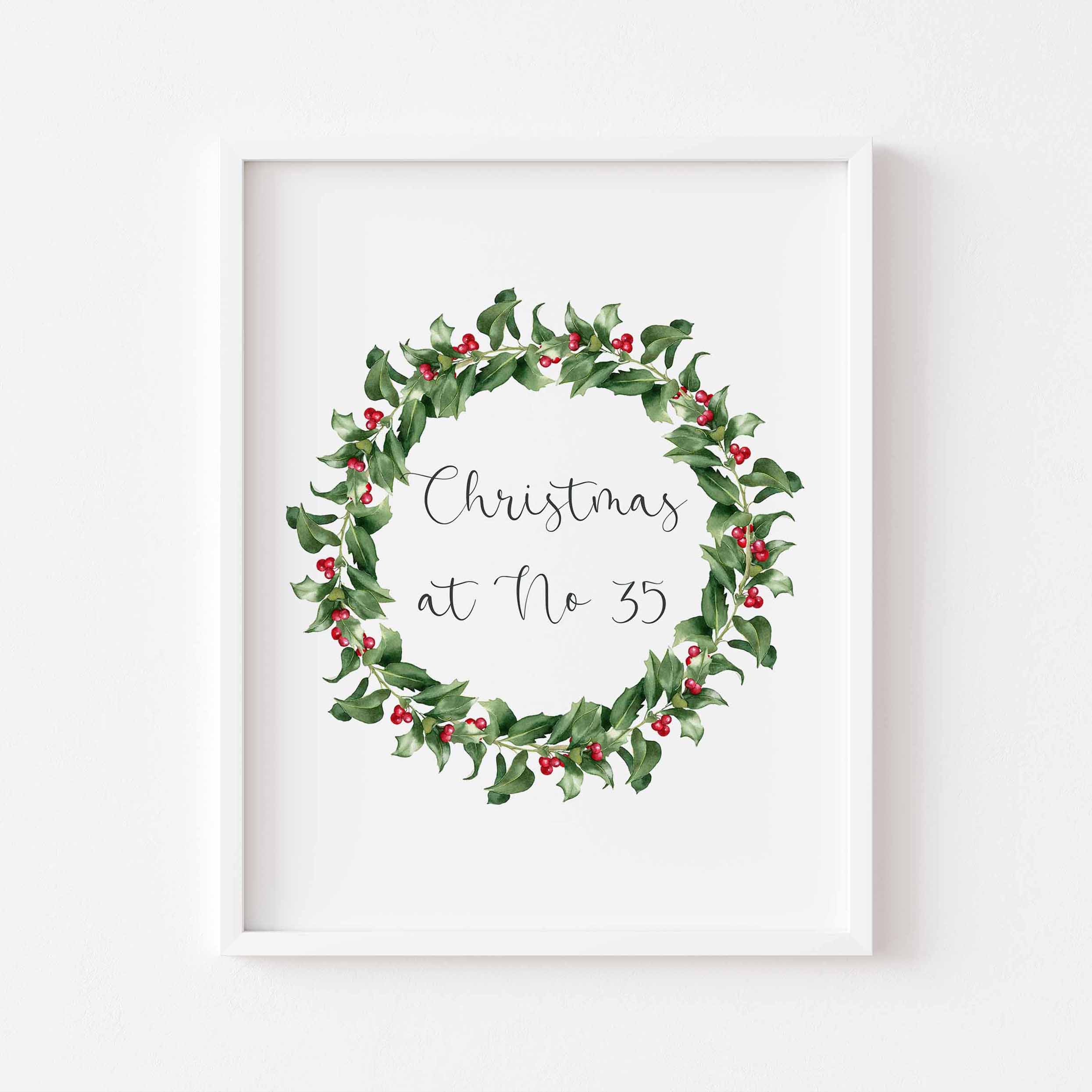 Personalised festive print featuring a watercolour wreath and your house number. A charming Christmas design to decorate your home.