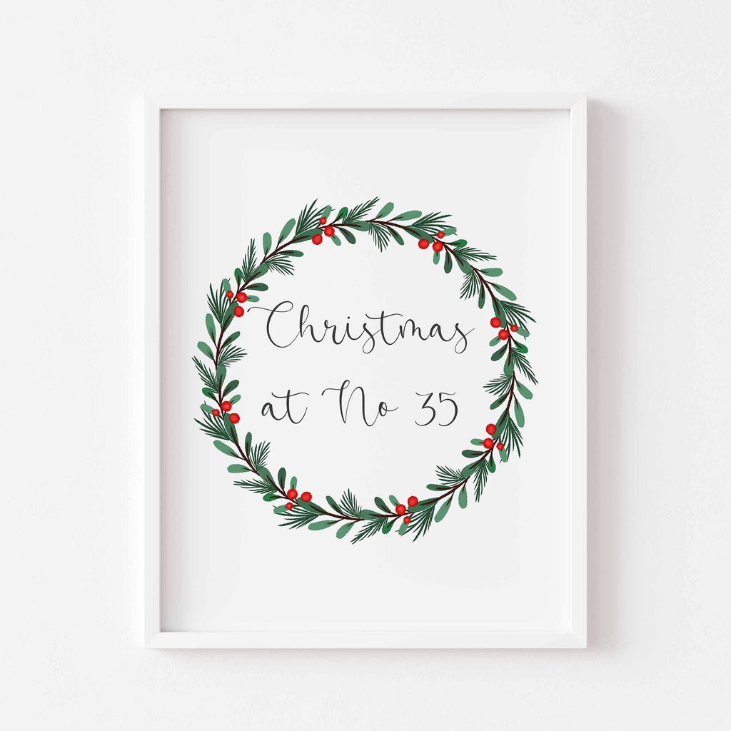A personalised Christmas print featuring your house number inside a festive watercolour wreath. Perfect for cosy holiday home decor.
