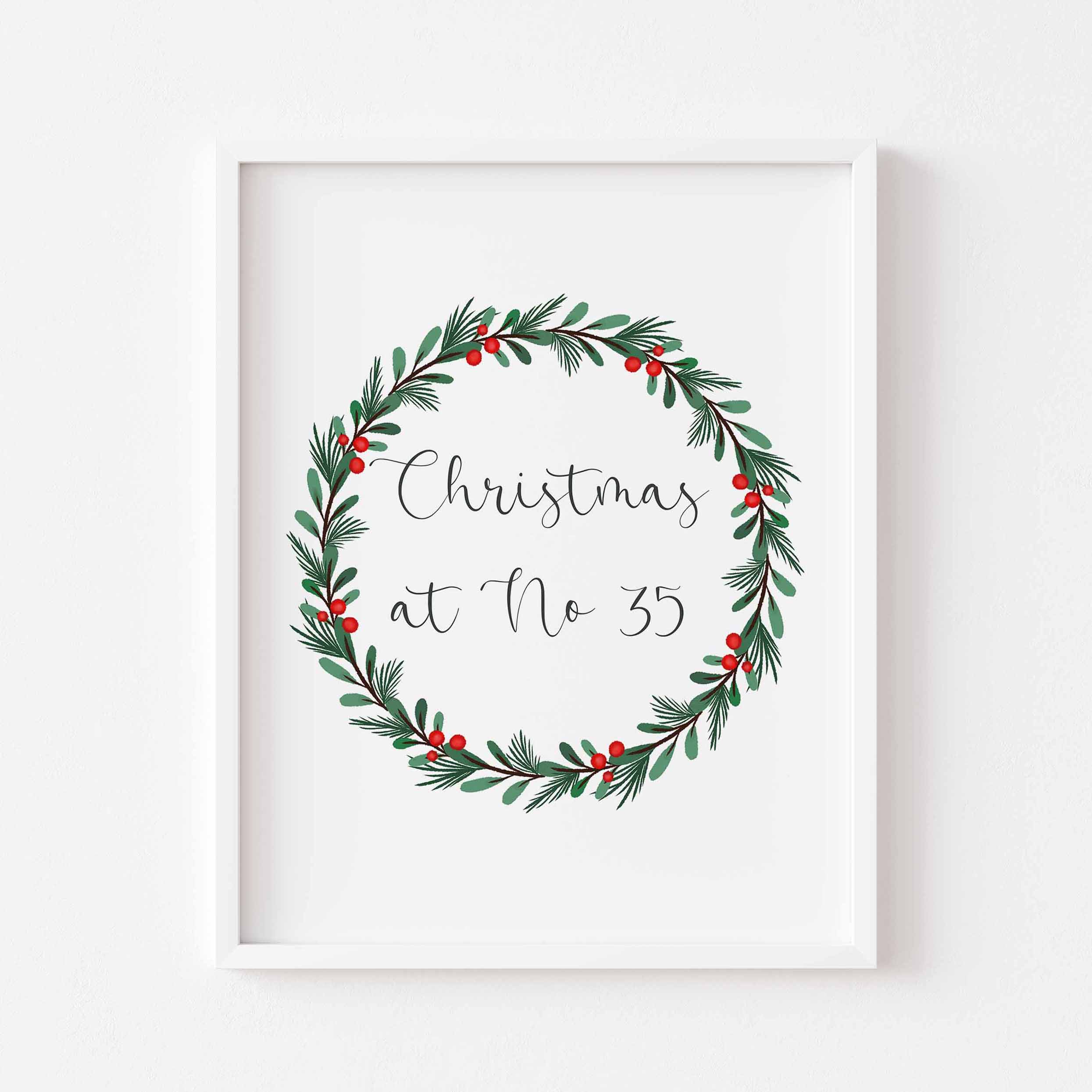 A personalised Christmas print featuring your house number inside a festive watercolour wreath. Perfect for cosy holiday home decor.