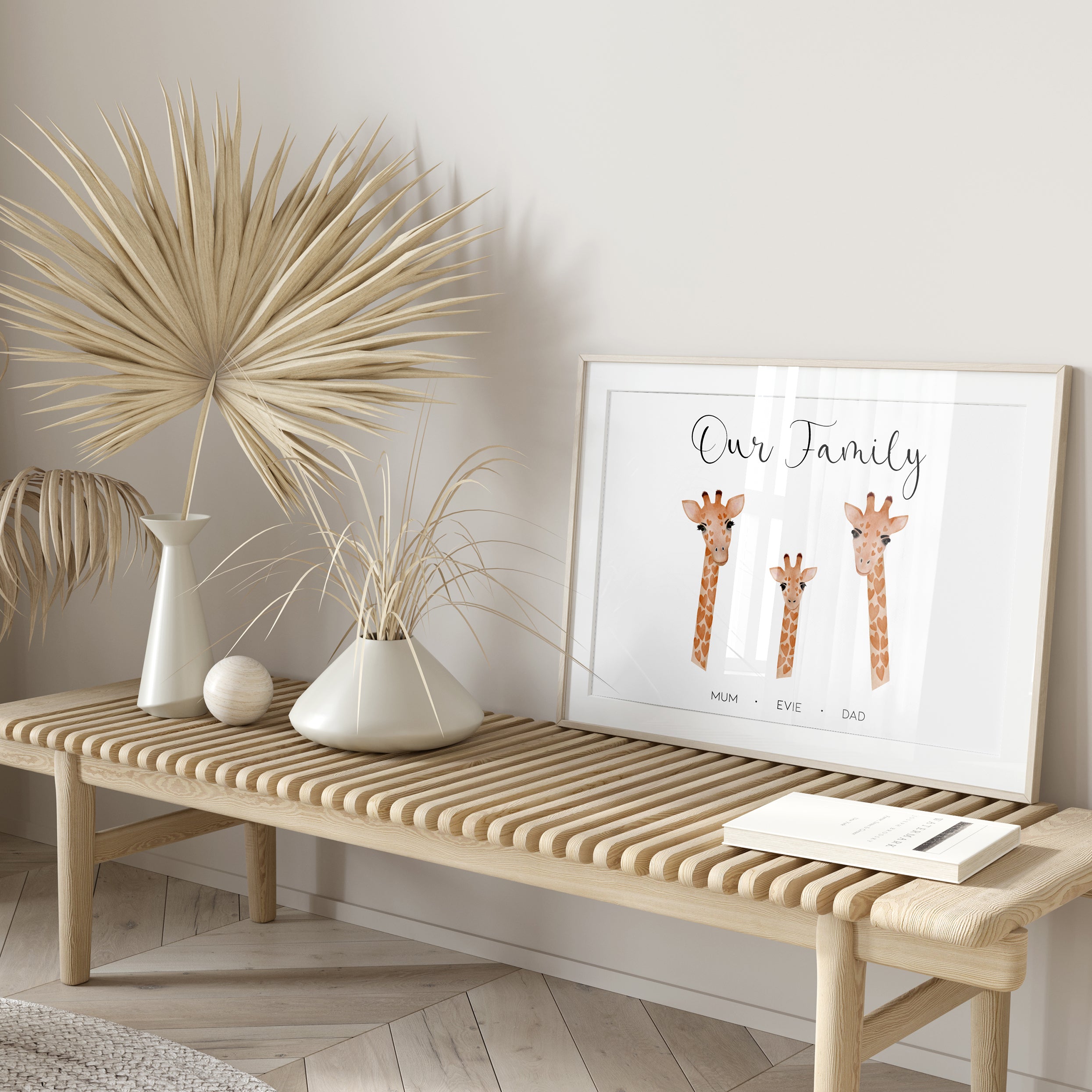 Close-up view showing giraffe illustrations and names on personalised family print