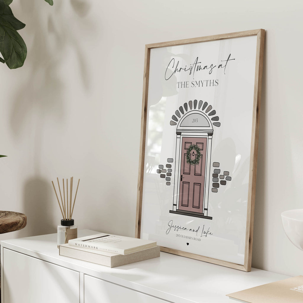 Close-up of illustrated festive front door with wreath and address details