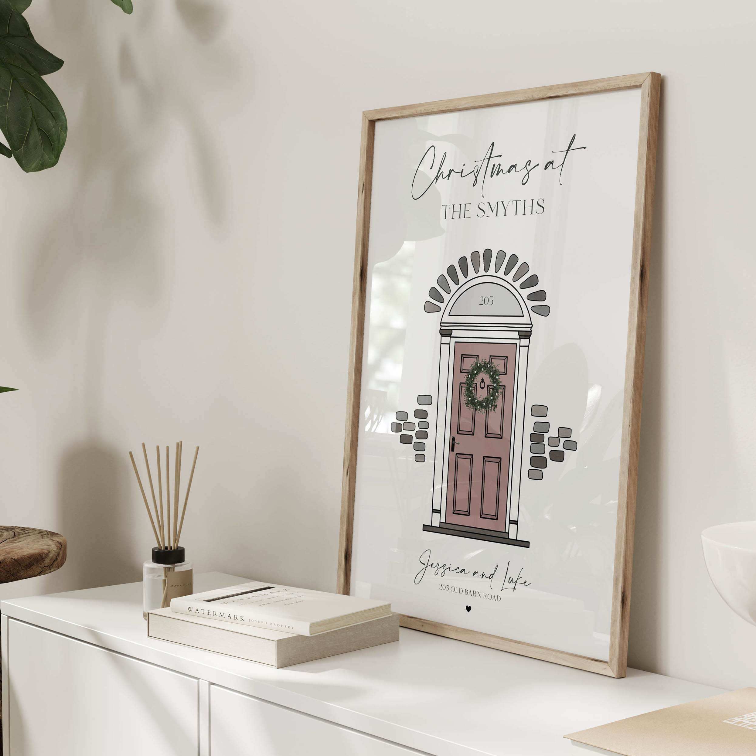 Close-up of illustrated festive front door with wreath and address details