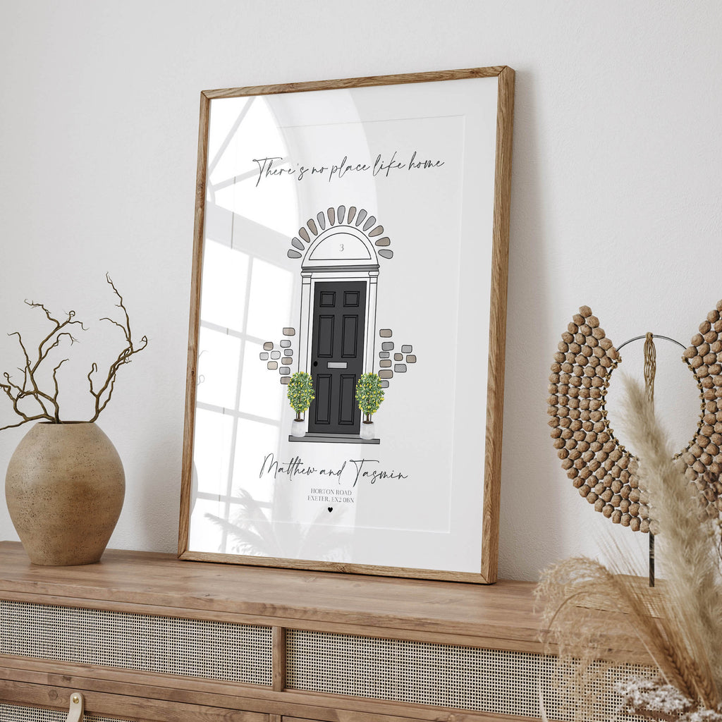 Personalised “There’s No Place Like Home” print shown in different door colours and styles