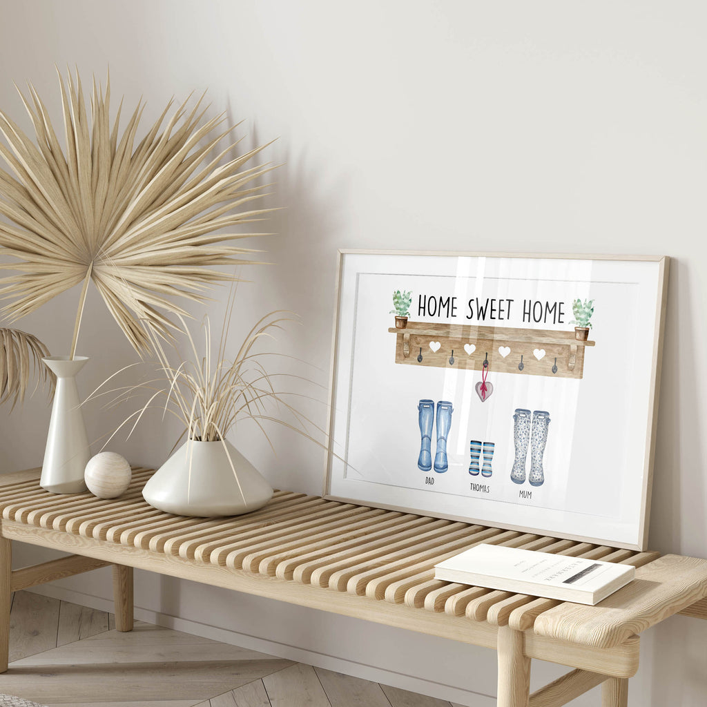 Framed Our Family personalised print with wellies and coats displayed in modern home