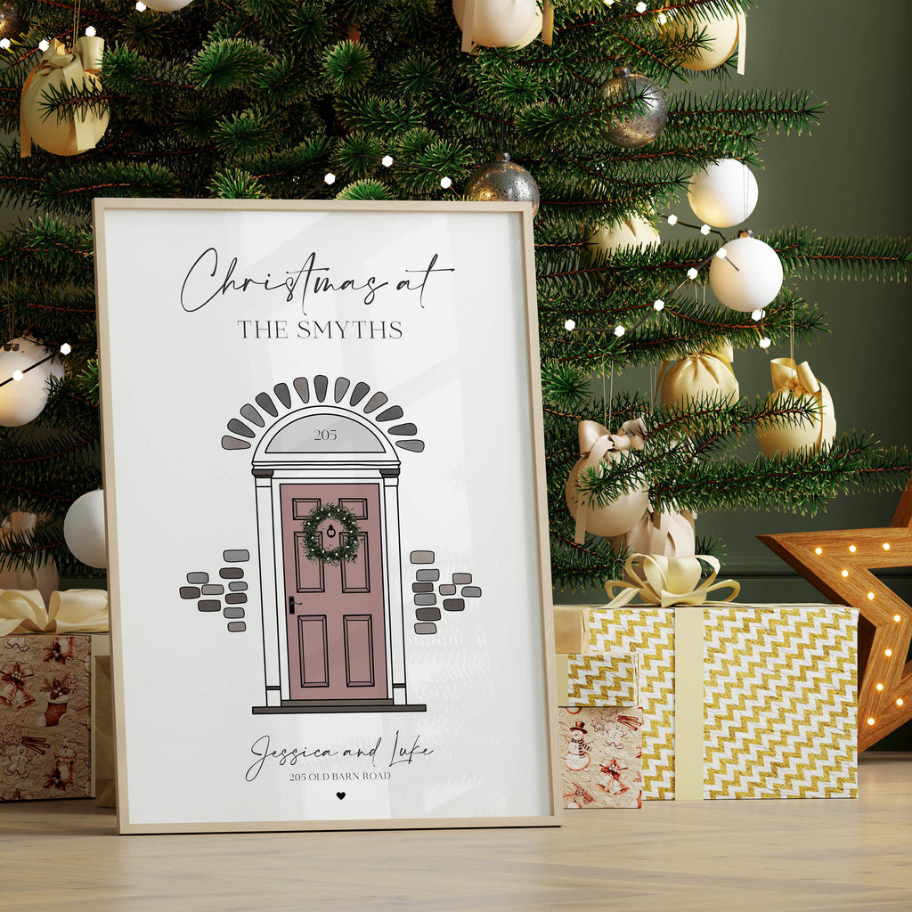 Framed personalised Christmas front door wall art displayed in cosy living room