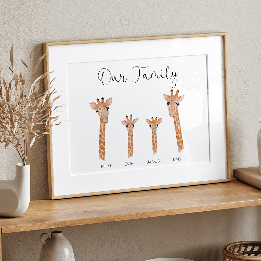 Flatlay of unframed personalised Family Giraffe Print shown on desk