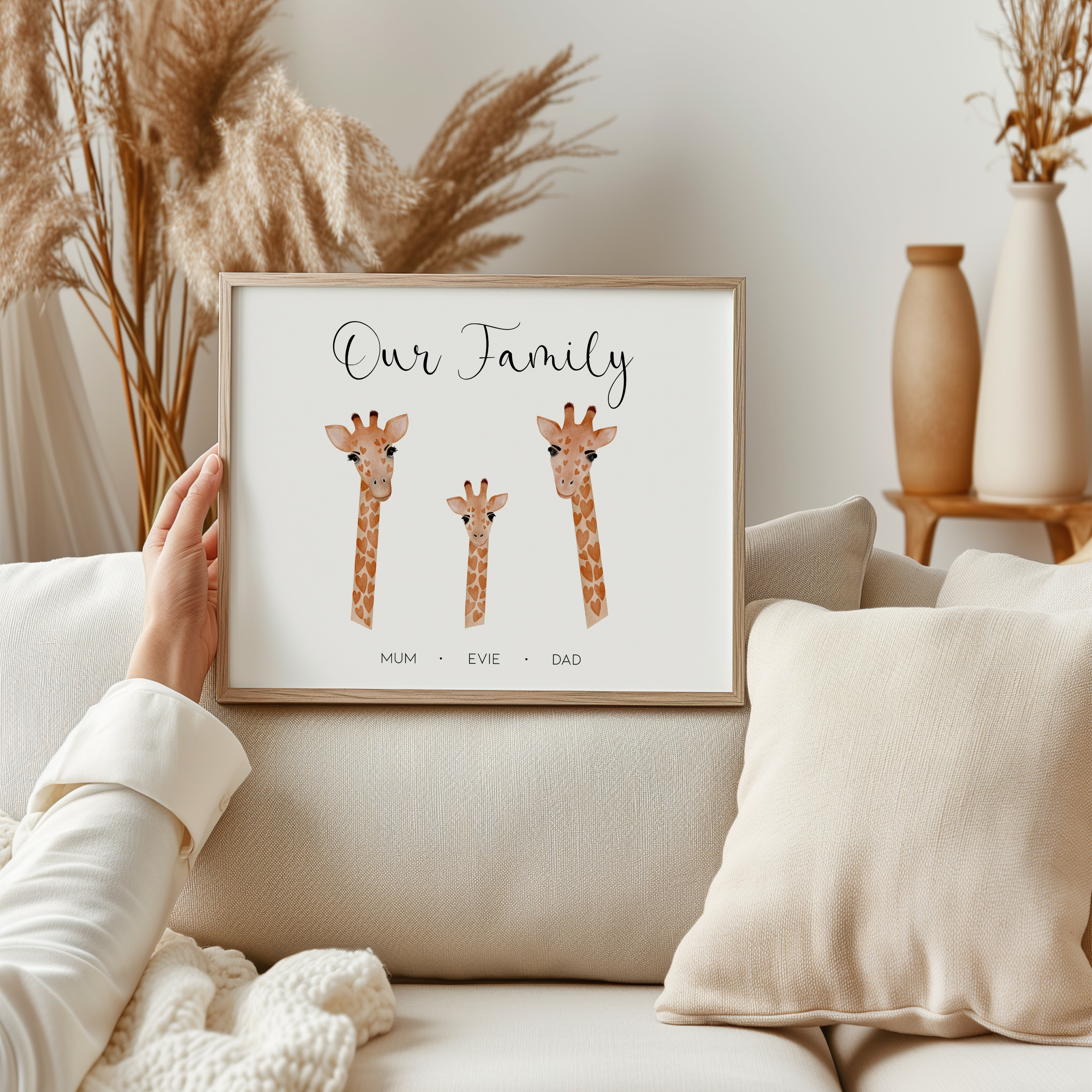 Framed personalised family giraffe wall art displayed in modern home