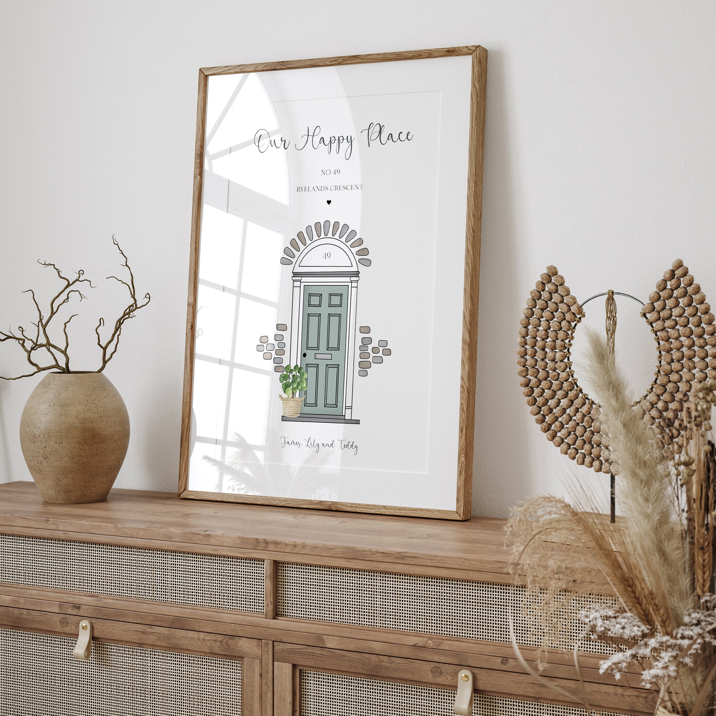 Framed personalised front door wall art displayed in hallway or living room